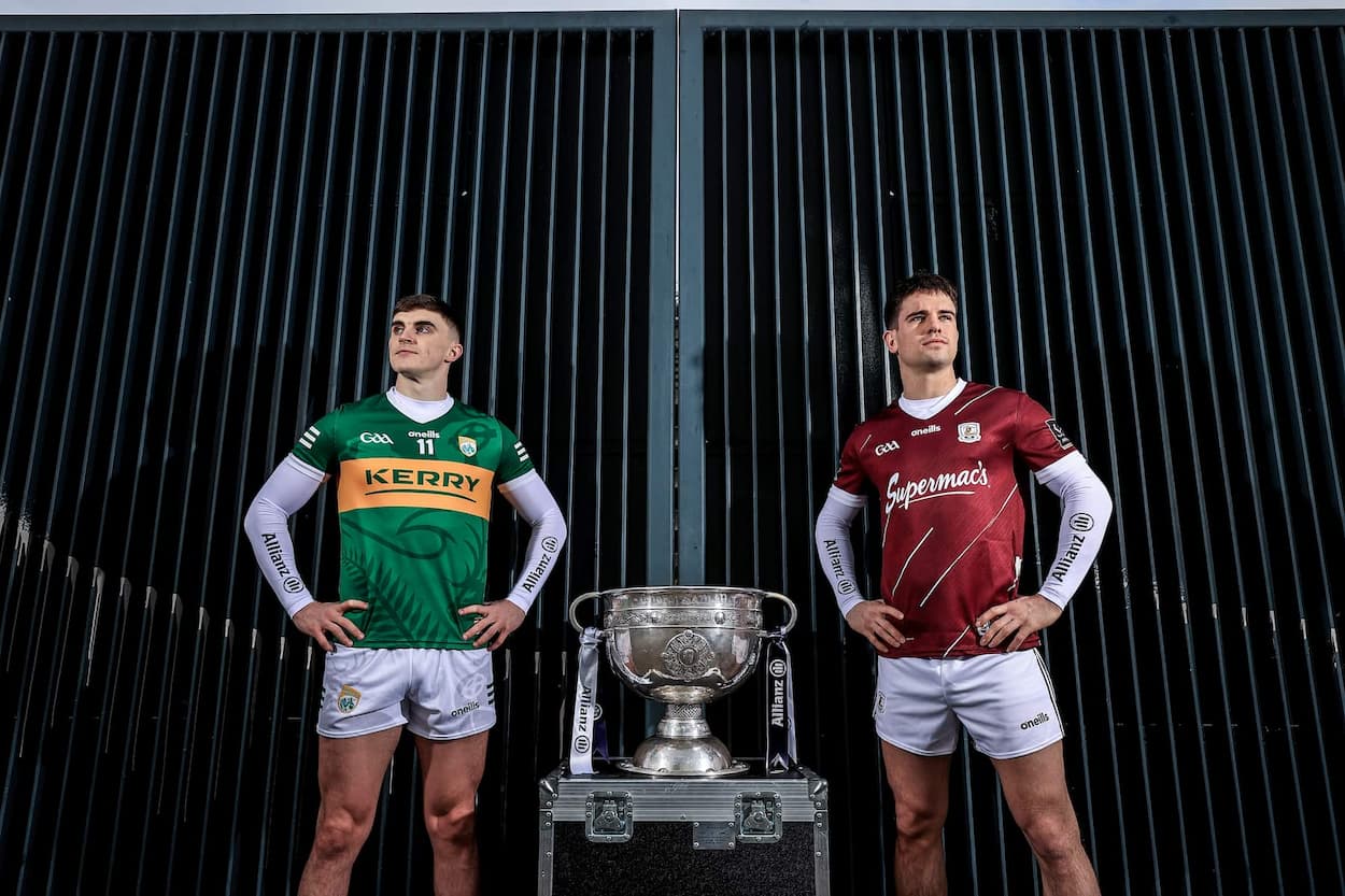 GAA players standing at gate to Croke Park