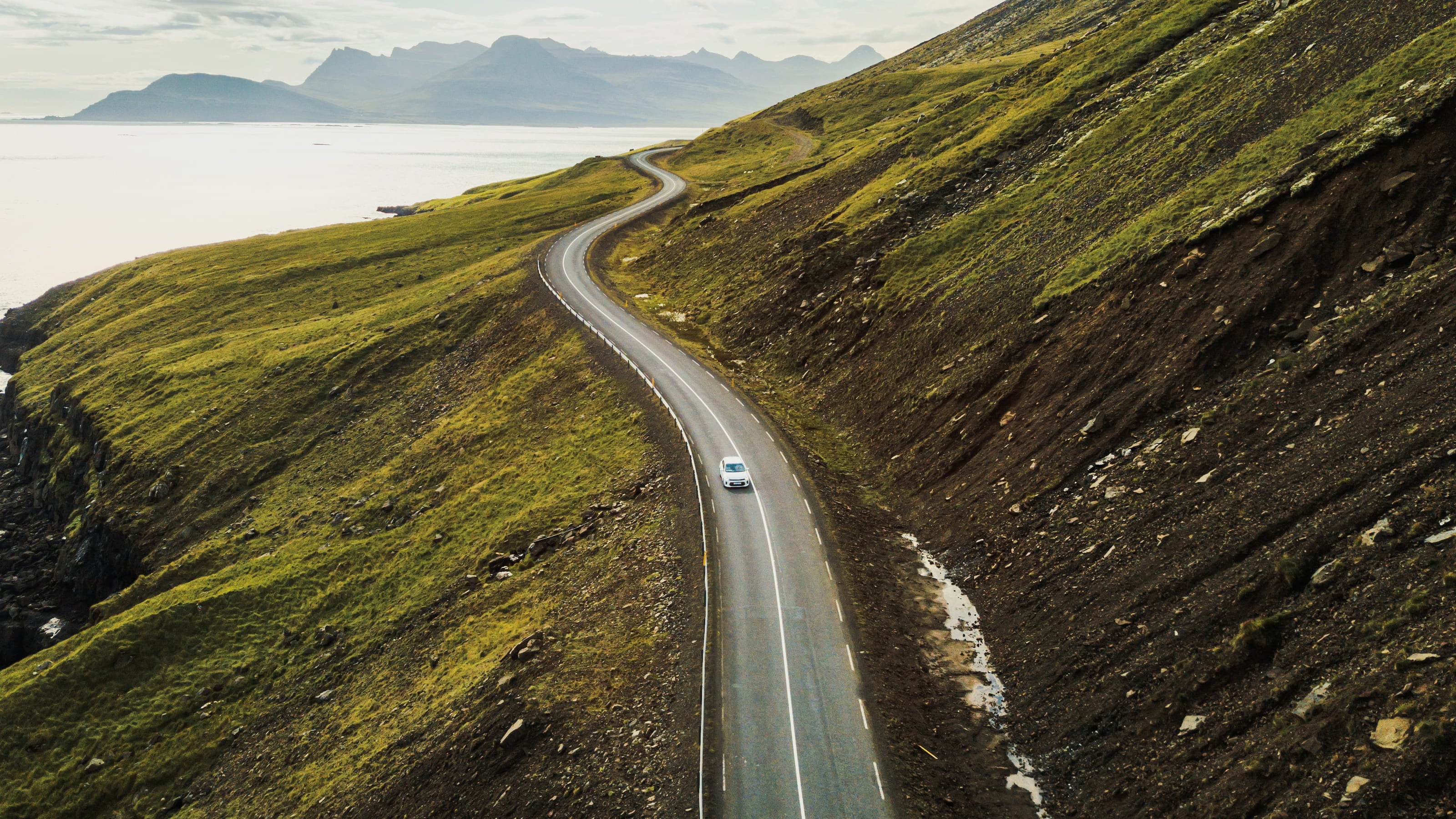 one car driving on mountain road