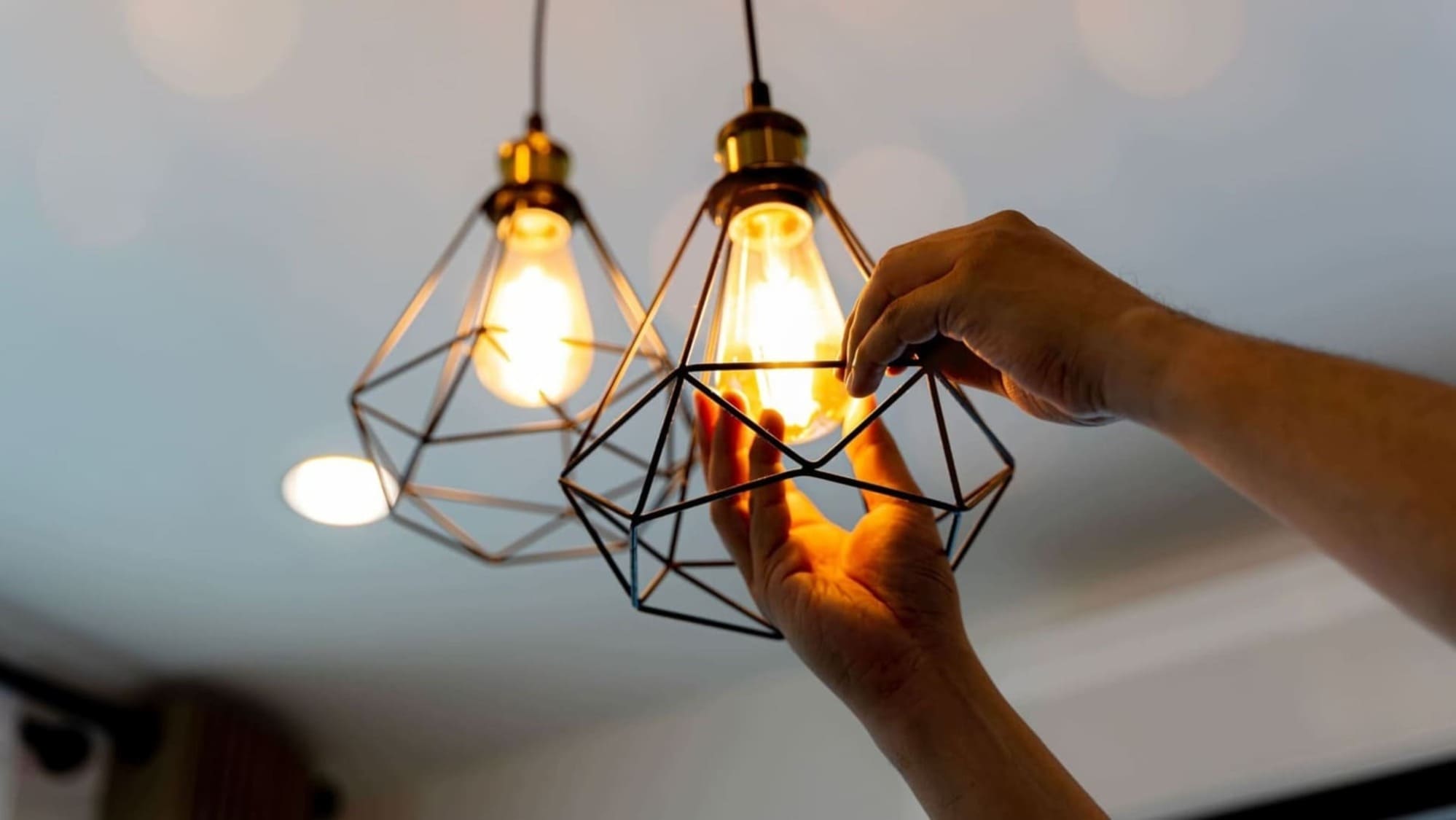 hanging new lamp shade covering ceiling bulb