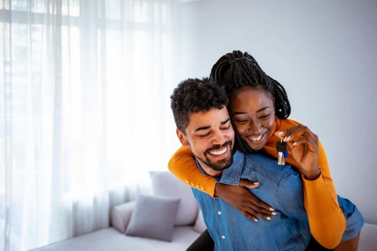 couple with new key to new house