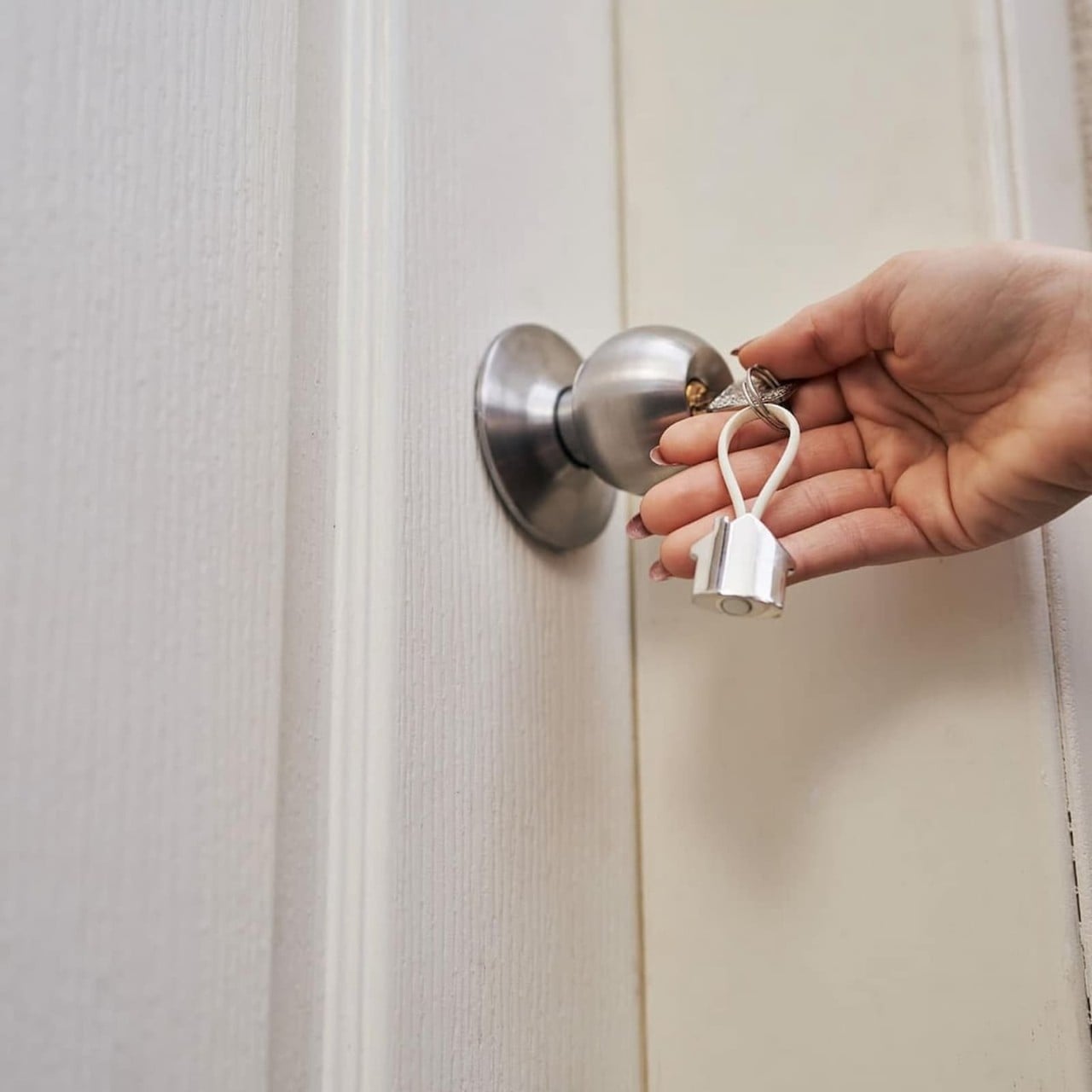 person locking their door