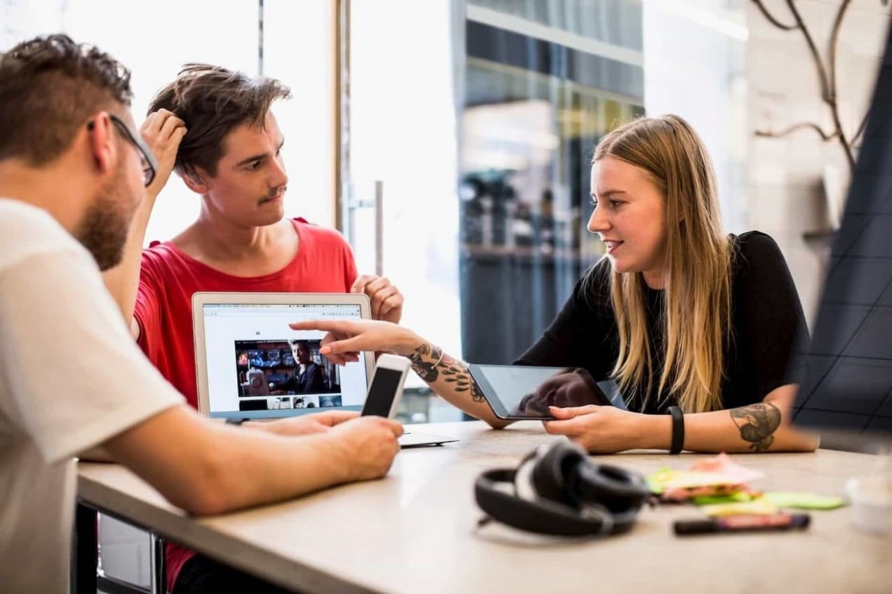 Insurance agents discussing new policy with customer