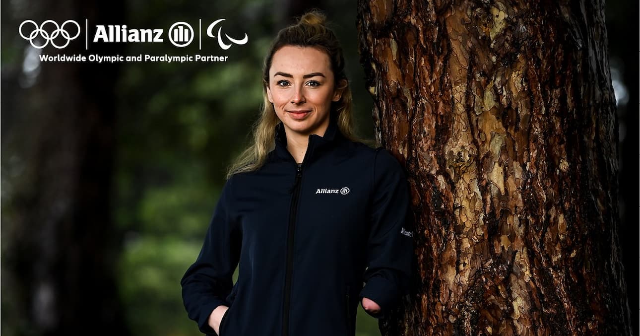 Allianz Paralympian standing at tree