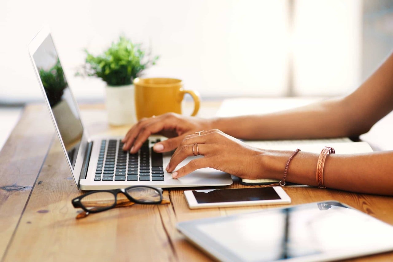 woman working on laptop at desk 