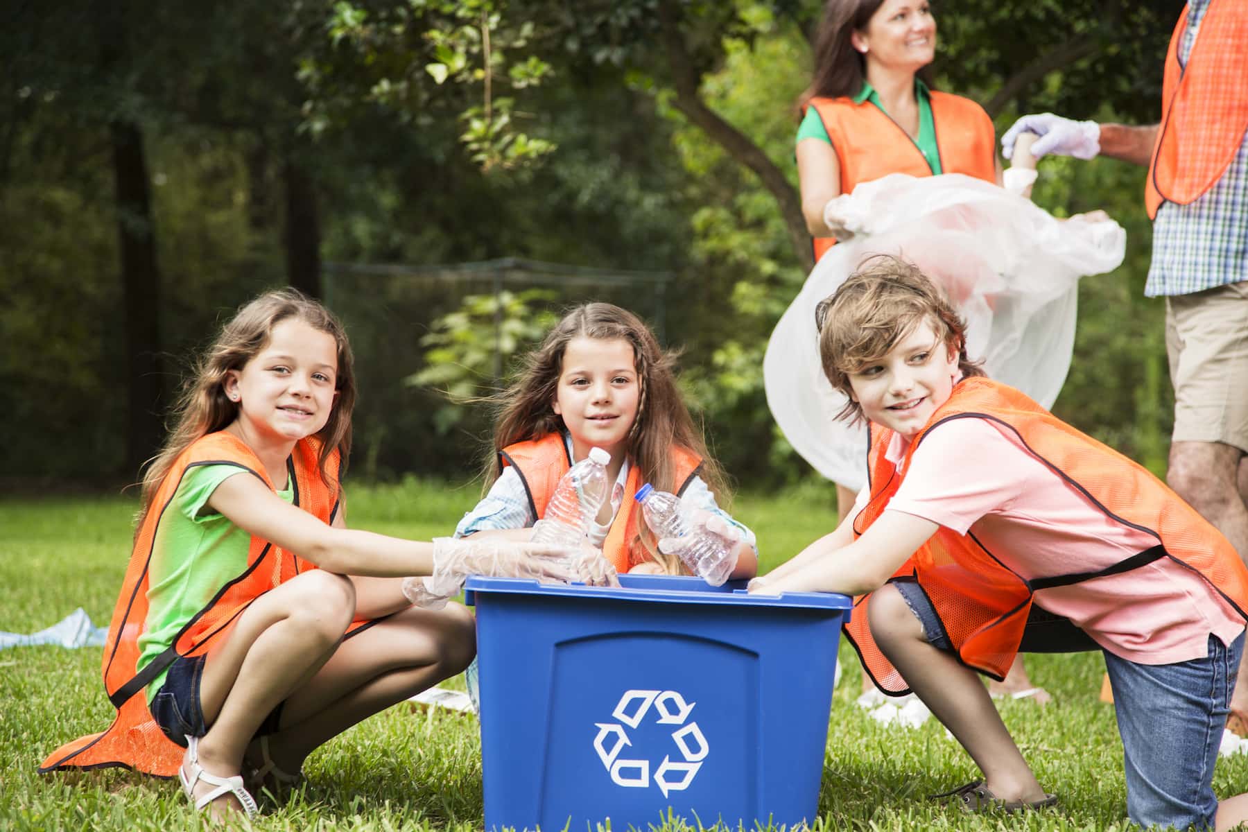 Children working at recycling bin
