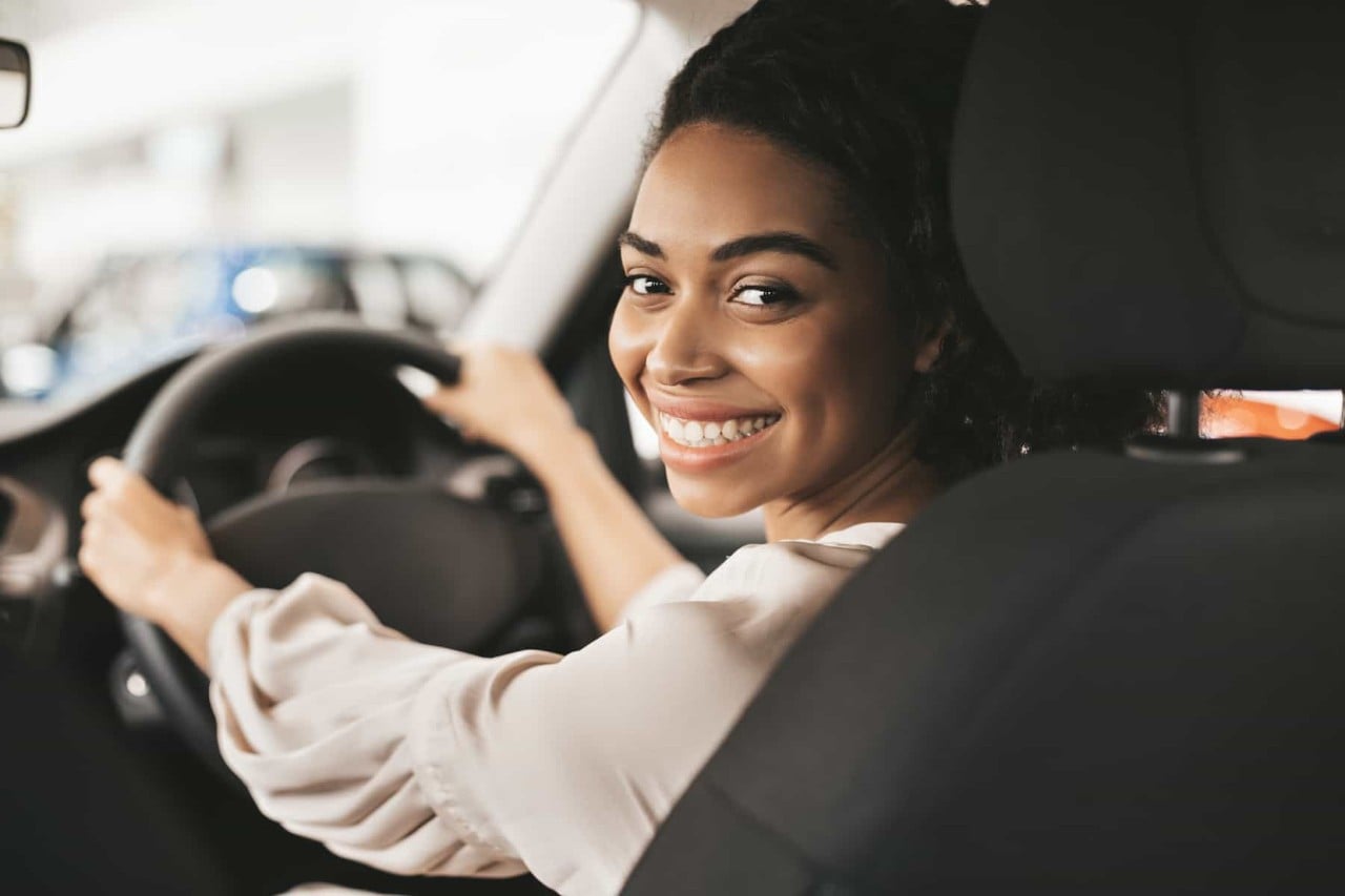 young female driver in the car
