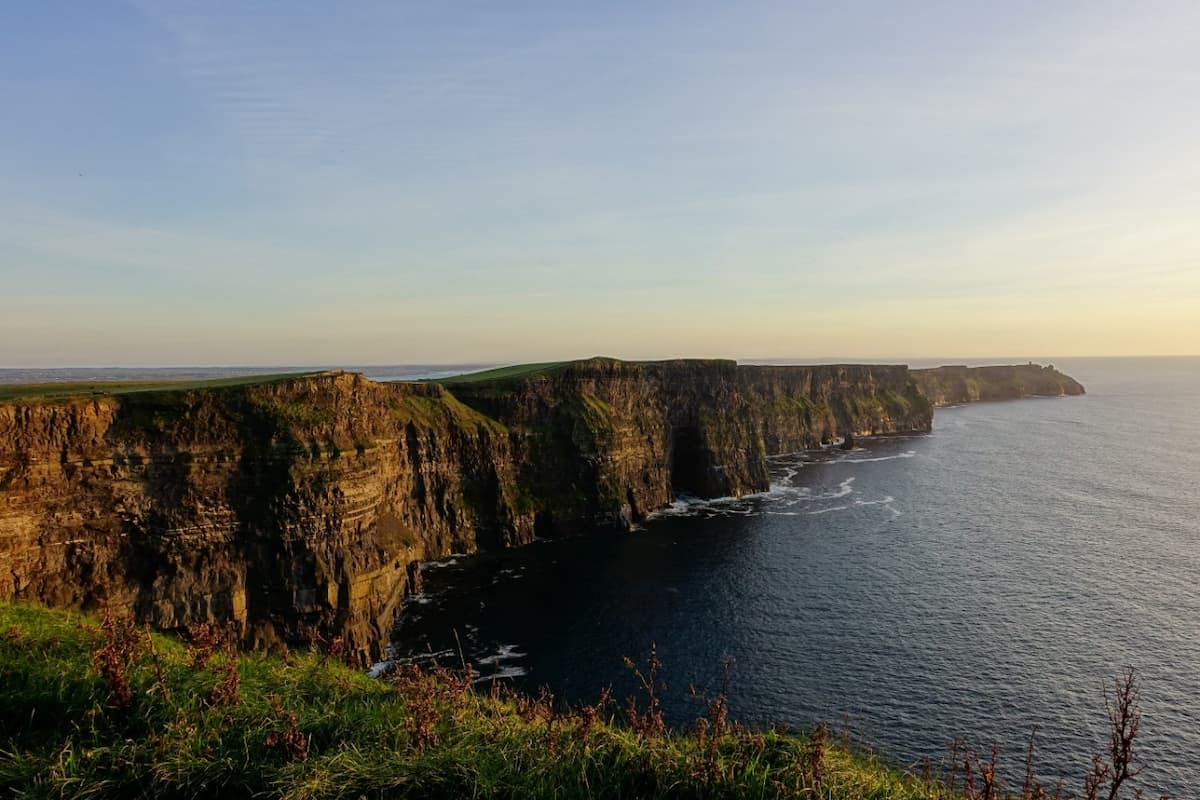 sunset over Irish cliff