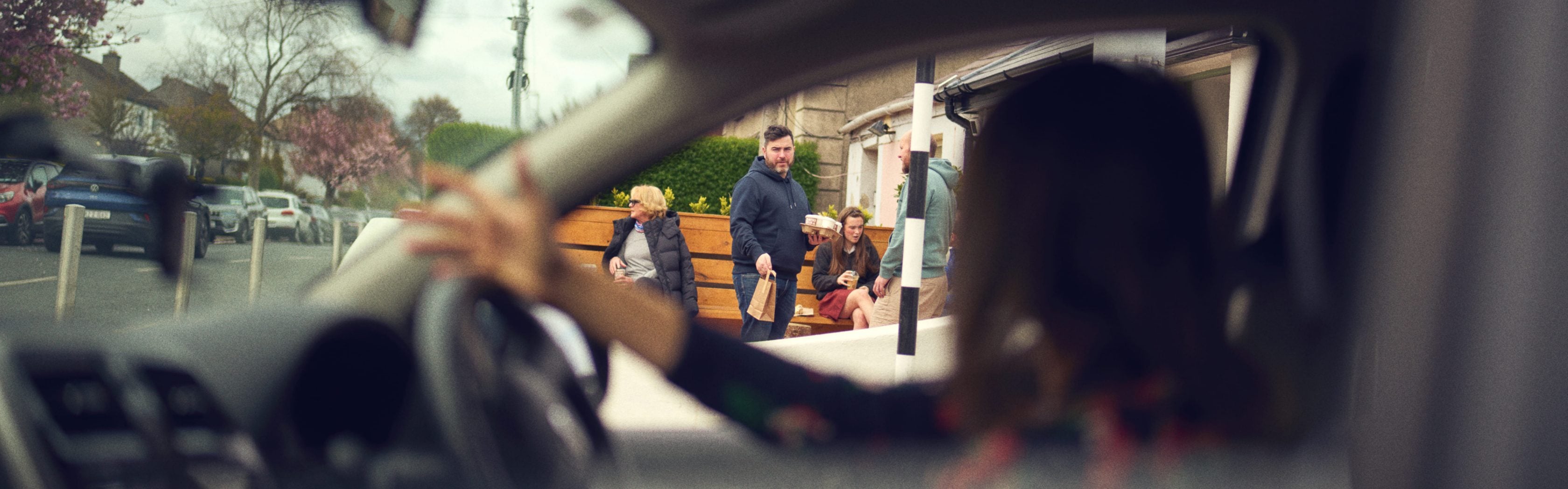 man sitting down using phone