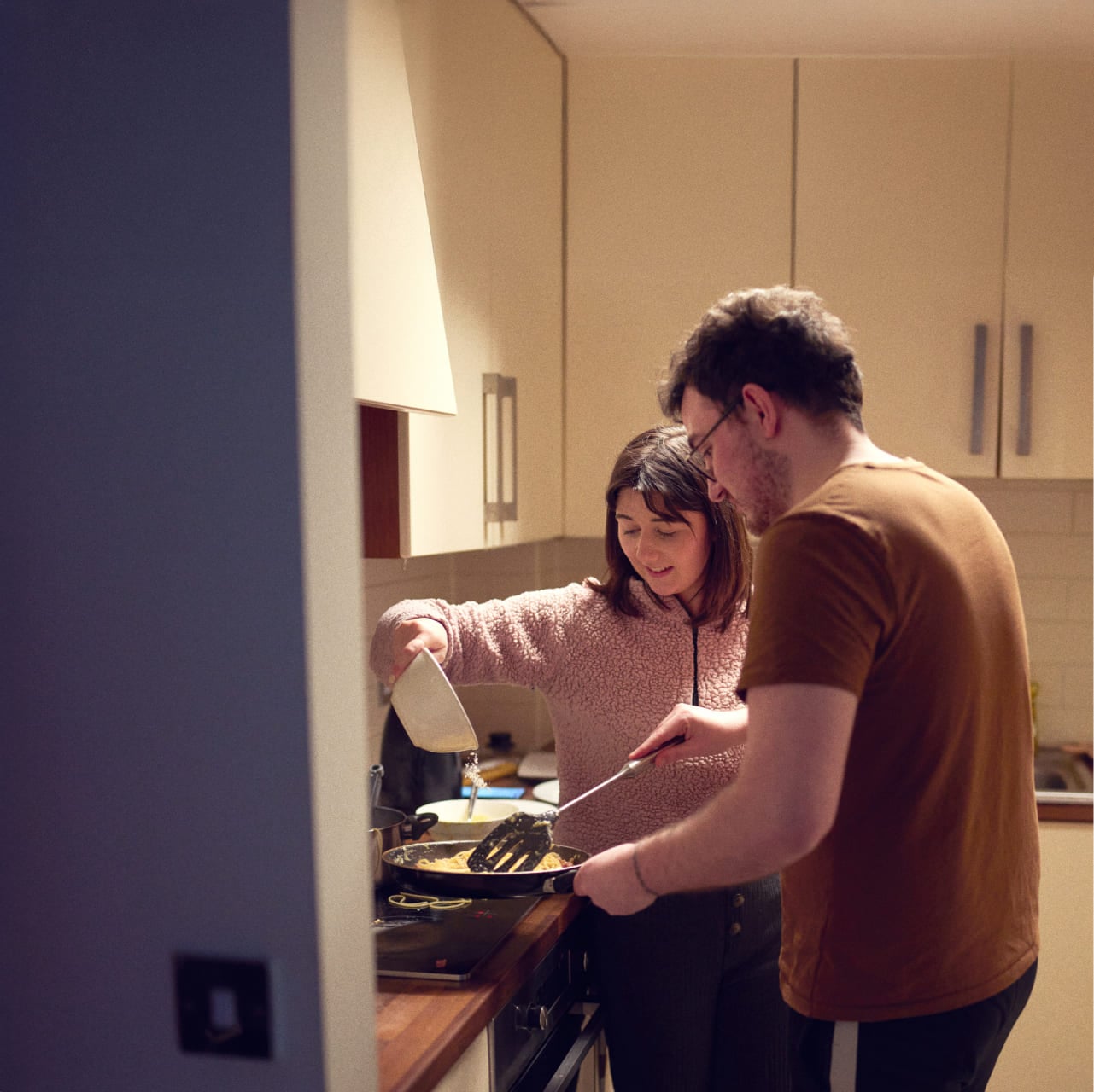 Couple cooking at home